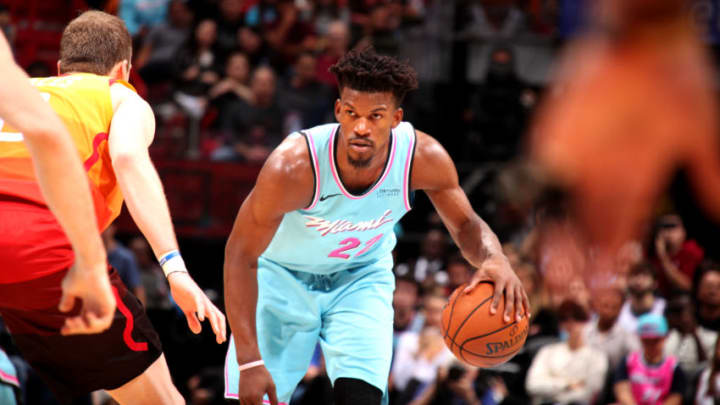 MIAMI, FL - DECEMBER 23: Jimmy Butler #22 of the Miami Heat handles the ball during a game against the Utah Jazz on December 23, 2019 at American Airlines Arena in Miami, Florida. NOTE TO USER: User expressly acknowledges and agrees that, by downloading and or using this Photograph, user is consenting to the terms and conditions of the Getty Images License Agreement. Mandatory Copyright Notice: Copyright 2019 NBAE (Photo by Issac Baldizon/NBAE via Getty Images)