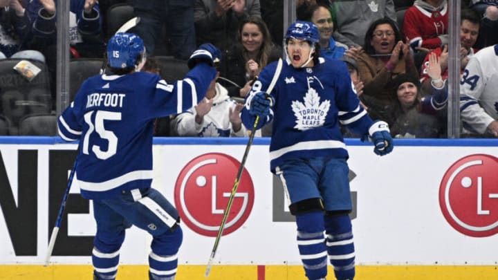 Sep 28, 2022; Toronto, Ontario, CAN; Toronto Maple Leafs forward Nick Robertson (89) celebrates with forward Alexander Kerfoot (15) after scoring against the Montreal Canadiens in the first period at Scotiabank Arena. Mandatory Credit: Dan Hamilton-USA TODAY Sports