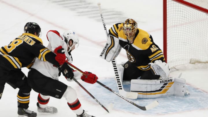 Mar 7, 2021; Boston, Massachusetts, USA; New Jersey Devils center Pavel Zacha (37) tries to control the puck in front of Boston Bruins goaltender Tuukka Rask (40) during the second period at TD Garden. Mandatory Credit: Winslow Townson-USA TODAY Sports