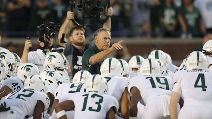 ANN ARBOR, MI - OCTOBER 07: Michigan State Spartans head football coach Mark Dantonio talks with his team prior to the start of the game against the Michigan Wolverines at Michigan Stadium on October 7, 2017 in Ann Arbor, Michigan. (Photo by Leon Halip/Getty Images)