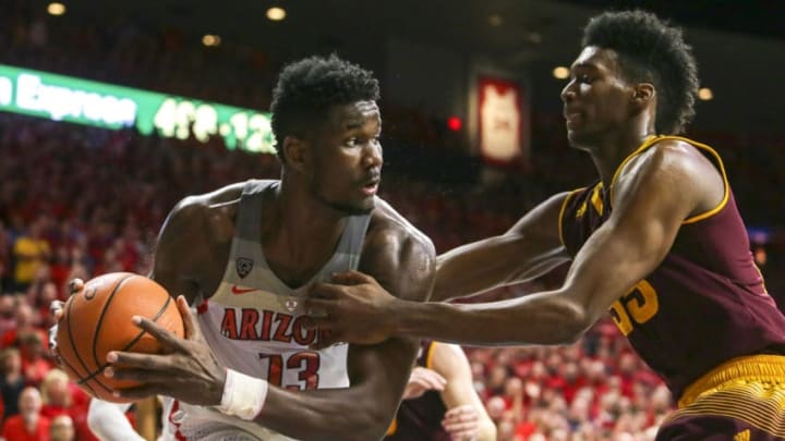 TUCSON, AZ - DECEMBER 30: Arizona Wildcats forward Deandre Ayton (13) gets held by Arizona State Sun Devils forward De'Quon Lake (35) during the a college basketball game between Arizona State Sun Devils and the Arizona Wildcats on December 30, 2017, at McKale Center in Tucson, AZ. Arizona defeated the Arizona State Sun Devils 84-78. (Photo by Jacob Snow/Icon Sportswire via Getty Images)