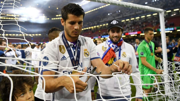 CARDIFF, WALES - JUNE 03: Alvaro Morata of Real Madrid cuts the net after the UEFA Champions League Final between Juventus and Real Madrid at National Stadium of Wales on June 3, 2017 in Cardiff, Wales. (Photo by Shaun Botterill/Getty Images)