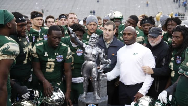 BIRMINGHAM, AL - DECEMBER 23: Head coach Charlie Strong of the South Florida Bulls gathers his team around the championship trophy following the Birmingham Bowl against the Texas Tech Red Raiders at Legion Field on December 23, 2017 in Birmingham, Alabama. South Florida won 38-34. (Photo by Joe Robbins/Getty Images)