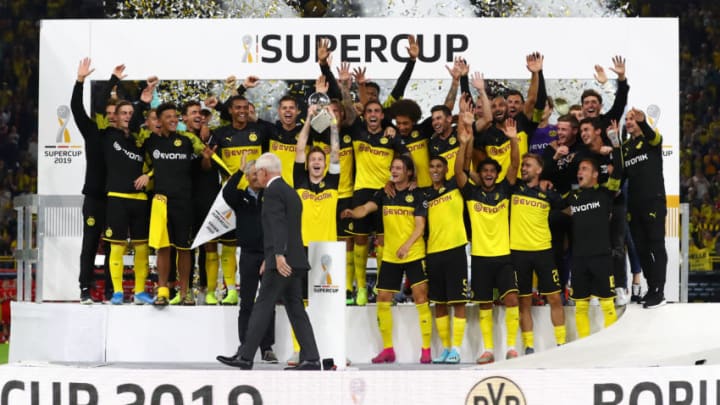 DORTMUND, GERMANY - AUGUST 03: Marco Reus of Borussia Dortmund lifts the DFL Super Cup Trophy following his team's victory in the DFL Supercup 2019 match between Borussia Dortmund and FC Bayern München at Signal Iduna Park on August 03, 2019 in Dortmund, Germany. (Photo by Martin Rose/Bongarts/Getty Images)