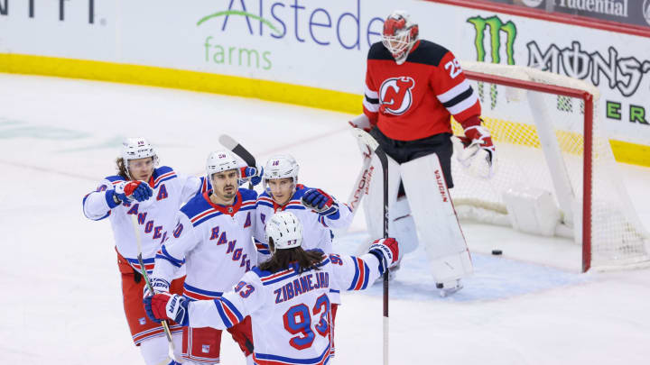 New York Rangers left wing Chris Kreider (20) celebrates his goal against New Jersey Devils goaltender Mackenzie Blackwood (29) with teammates during the first period at Prudential Center. Credit: Vincent Carchietta-USA TODAY Sports