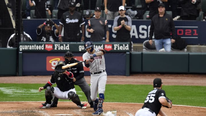 CHICAGO, ILLINOIS - OCTOBER 12: Carlos Correa #1 of the Houston Astros hits a two-run double during the 3rd inning of Game 4 of the American League Division Series against the Chicago White Sox at Guaranteed Rate Field on October 12, 2021 in Chicago, Illinois. (Photo by Quinn Harris/Getty Images)