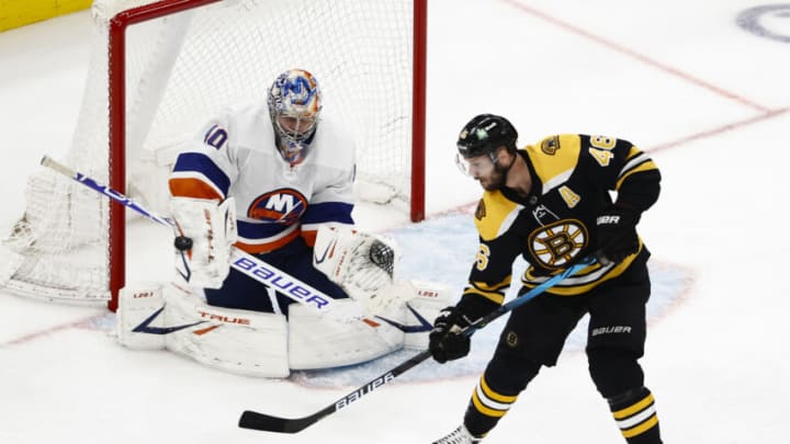 Jun 7, 2021; Boston, Massachusetts, USA; New York Islanders goaltender Semyon Varlamov (40) makes a save with Boston Bruins center David Krejci (46) standing in front during the second period of game five of the second round of the 2021 Stanley Cup Playoffs at TD Garden. Mandatory Credit: Winslow Townson-USA TODAY Sports