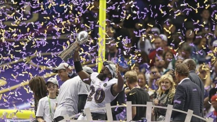 Feb 3, 2013; New Orleans, LA, USA; Baltimore Ravens free safety Ed Reed (20) celebrates with the Vince Lombardi Trophy in Super Bowl XLVII at the Mercedes-Benz Superdome. Mandatory Credit: Chuck Cook-USA TODAY Sports