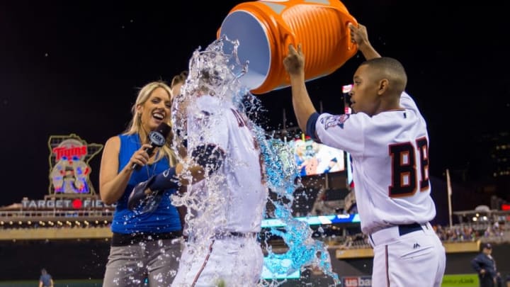 Jun 7, 2016; Minneapolis, MN, USA; Minnesota Twins bat boy Dominic Frost dumps gatorade on second baseman Brian Dozier (2) after his walk off home run in the eleventh inning against the Miami Marlins at Target Field. The Minnesota Twins beat the Miami Marlins 6-4 in 11 innings. Mandatory Credit: Brad Rempel-USA TODAY Sports