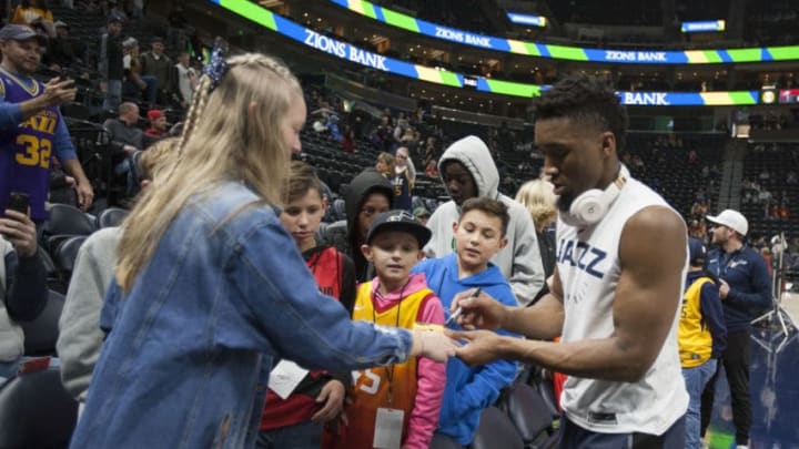 SALT LAKE CITY, UT - DECEMBER 25: Donovan Mitchell #45 of the Utah Jazz signs autographs for fans during warmups before their game against the Portland Trail Blazers at the Vivint Smart Home Arena on December 25, 2018 in Salt Lake City , Utah. NOTE TO USER: User expressly acknowledges and agrees that, by downloading and or using this photograph, User is consenting to the terms and conditions of the Getty Images License Agreement. (Photo by Chris Gardner/Getty Images)