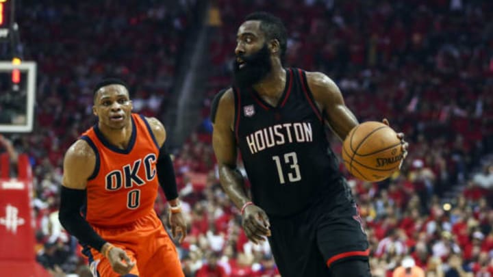 Apr 16, 2017; Houston, TX, USA; Houston Rockets guard James Harden (13) dribbles the ball during the third quarter as Oklahoma City Thunder guard Russell Westbrook (0) defends in game one of the first round of the 2017 NBA Playoffs at Toyota Center. Mandatory Credit: Troy Taormina-USA TODAY Sports