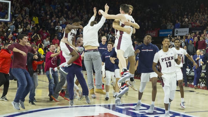 PHILADELPHIA, PA – DECEMBER 11: AJ Brodeur #25, Max Rothschild #0, and Eddie Scott #13 of the Pennsylvania Quakers celebrate their win against the Villanova Wildcats at The Palestra on December 11, 2018 in Philadelphia, Pennsylvania. The Quakers defeated the Wildcats 78-75. (Photo by Mitchell Leff/Getty Images)