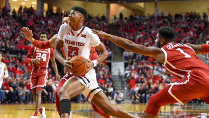 LUBBOCK, TX - JANUARY 08: Jarrett Culver #23 of the Texas Tech Red Raiders drives to the basket against Rashard Odomes #1 of the Oklahoma Sooners during the first half of the game on January 8, 2019 at United Supermarkets Arena in Lubbock, Texas. (Photo by John Weast/Getty Images)