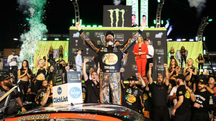 HOMESTEAD, FL - NOVEMBER 19: Martin Truex Jr., driver of the #78 Bass Pro Shops/Tracker Boats Toyota, celebrates in Victory Lane after winning the Monster Energy NASCAR Cup Series Championship and the Monster Energy NASCAR Cup Series Championship Ford EcoBoost 400 at Homestead-Miami Speedway on November 19, 2017 in Homestead, Florida. (Photo by Chris Graythen/Getty Images)