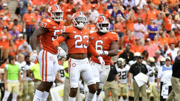 CLEMSON, SC - OCTOBER 07: Safety Van Smith #23, linebacker Tre Lamar #57, and linebacker Dorian O'Daniel #6 of the Clemson Tigers celebrate during their game against the Wake Forest Demon Deacons at Memorial Stadium on October 7, 2017 in Clemson, South Carolina. (Photo by Mike Comer/Getty Images)