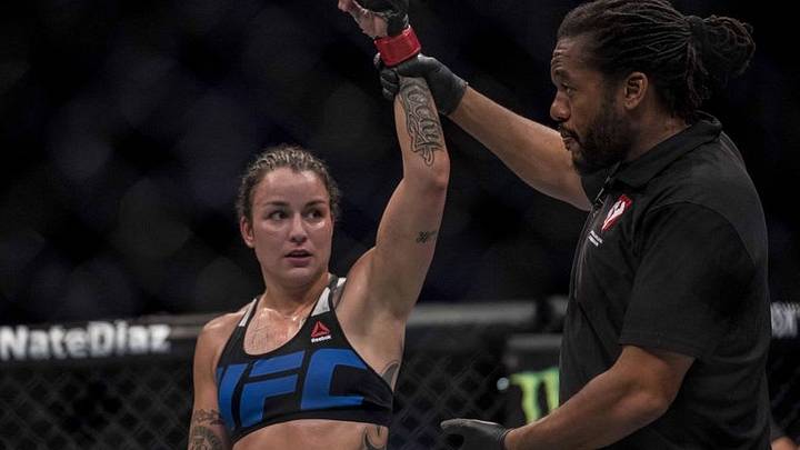Aug 20, 2016; Las Vegas, NV, USA; Raquel Pennington (red gloves) reacts after the fight between Elizabeth Phillips (blue gloves) during UFC 202 at T-Mobile Arena. Mandatory Credit: Joshua Dahl-USA TODAY Sports