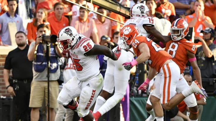 CLEMSON, SC - OCTOBER 20: Running back Reggie Gallaspy II #25 of the North Carolina State Wolfpack rushes for a touchdown against the Clemson Tigers during the fourth quarter of the football game at Clemson Memorial Stadium on October 20, 2018 in Clemson, South Carolina. (Photo by Mike Comer/Getty Images)