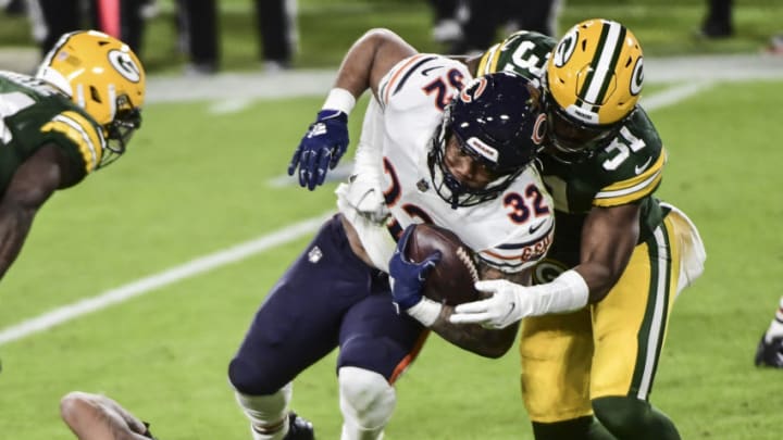 Nov 29, 2020; Green Bay, Wisconsin, USA; Chicago Bears running back David Montgomery (32) is tackled by Green Bay Packers safety Adrian Amos (31) in the fourth quarter at Lambeau Field. Mandatory Credit: Benny Sieu-USA TODAY Sports