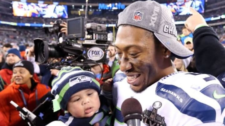 Feb 2, 2014; East Rutherford, NJ, USA; Seattle Seahawks outside linebacker Bruce Irvin (51) celebrates after winning Super Bowl XLVIII against the Denver Broncos at MetLife Stadium. Seattle Seahawks won 43-8. Mandatory Credit: Matthew Emmons-USA TODAY Sports