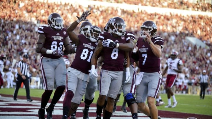 Sep 10, 2016; Starkville, MS, USA; Mississippi State Bulldogs wide receiver Fred Ross (8) celebrates with teammates after a touchdown during the first quarter of the game against the South Carolina Gamecocks at Davis Wade Stadium. Mandatory Credit: Matt Bush-USA TODAY Sports