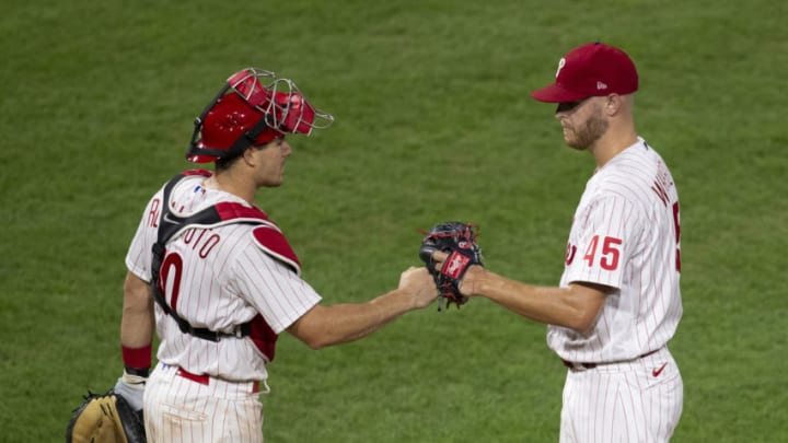 PHILADELPHIA, PA - SEPTEMBER 02: Zack Wheeler #45 of the Philadelphia Phillies fist bumps J.T. Realmuto #10 after being taken out of the game in the top of the seventh inning against the Washington Nationals at Citizens Bank Park on September 2, 2020 in Philadelphia, Pennsylvania. The Phillies defeated the Nationals 3-0. (Photo by Mitchell Leff/Getty Images)