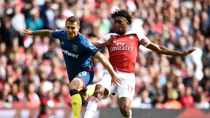 LONDON, ENGLAND - AUGUST 25: Jack Wilshere of West Ham United battles for posession with Alex Iwobi of Arsenal during the Premier League match between Arsenal FC and West Ham United at Emirates Stadium on August 25, 2018 in London, United Kingdom. (Photo by Clive Mason/Getty Images)