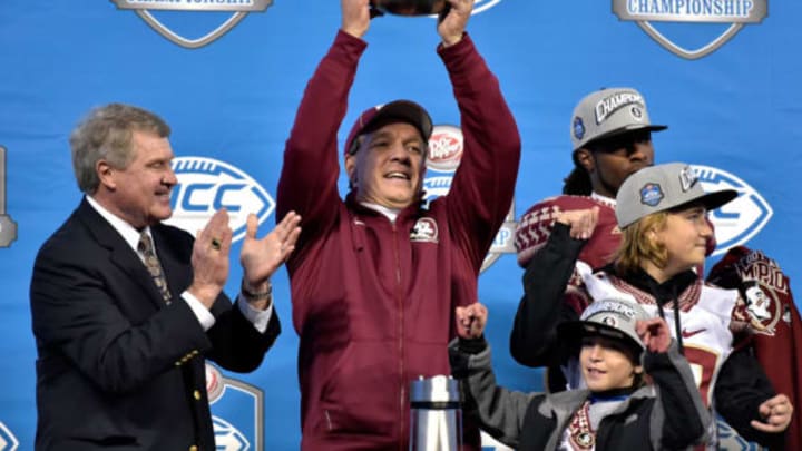 CHARLOTTE, NC – DECEMBER 06: Head coach Jimbo Fisher of the Florida State Seminoles celebrates with the trophy after defeating the Georgia Tech Yellow Jackets to win the Atlantic Coast Conference championship on December 6, 2014 in Greenville, North Carolina. Florida State won 37-35. (Photo by Grant Halverson/Getty Images)