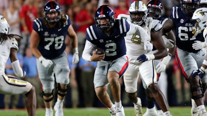 Sep 16, 2023; Oxford, Mississippi, USA; Mississippi Rebels quarterback Jaxson Dart (2) runs the ball for a first down during the first half against the Georgia Tech Yellow Jackets at Vaught-Hemingway Stadium. Mandatory Credit: Petre Thomas-USA TODAY Sports