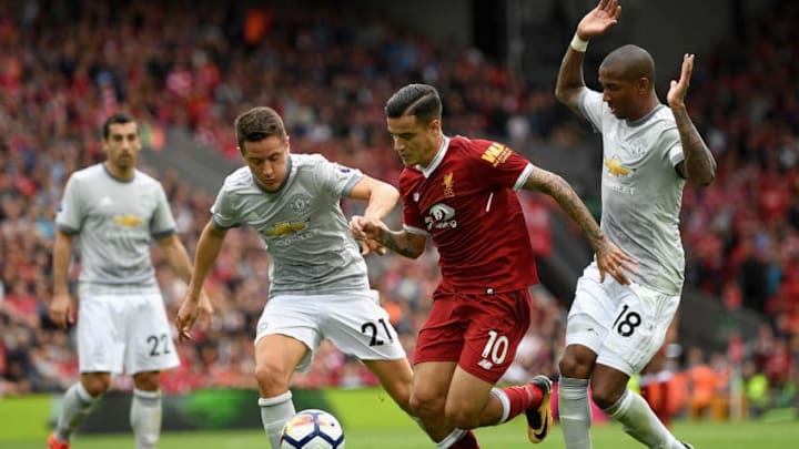 LIVERPOOL, ENGLAND - OCTOBER 14: Philippe Coutinho of Liverpool battles for possession with Ander Herrera and Ashley Young of Manchester United during the Premier League match between Liverpool and Manchester United at Anfield on October 14, 2017 in Liverpool, England. (Photo by Shaun Botterill/Getty Images)