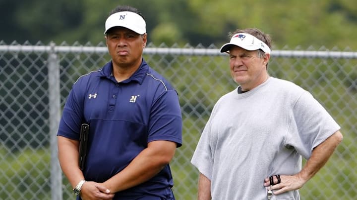 Jun 7, 2016; Foxborough, MA, USA; New England Patriots head coach Bill Belichick and Navy head coach Ken Niumatalolo watch New England Patriots mini camp at Gillette Stadium. Mandatory Credit: Winslow Townson-USA TODAY Sports