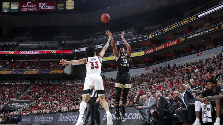 LOUISVILLE, KY – FEBRUARY 05: Andrien White #13 of the Wake Forest Demon Deacons shoots the ball over Jordan Nwora #33 of the Louisville Cardinals in the first half of a game at KFC YUM! Center on February 5, 2020 in Louisville, Kentucky. (Photo by Joe Robbins/Getty Images)