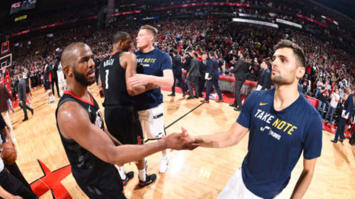 HOUSTON, TX – MAY 8: Chris Paul #3 of the Houston Rockets and Raul Neto #25 of the Utah Jazz hug after the game during Game Five of the Western Conference Semifinals of the 2018 NBA Playoffs on May 8, 2018 at the Toyota Center in Houston, Texas. NOTE TO USER: User expressly acknowledges and agrees that, by downloading and or using this photograph, User is consenting to the terms and conditions of the Getty Images License Agreement. Mandatory Copyright Notice: Copyright 2018 NBAE (Photo by Andrew D. Bernstein/NBAE via Getty Images)