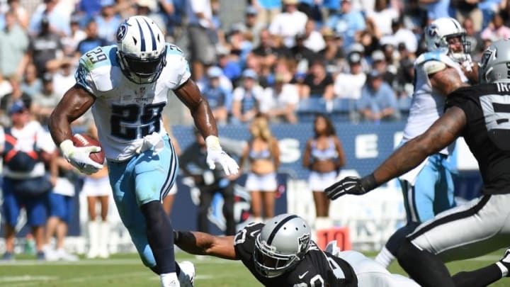 Sep 25, 2016; Nashville, TN, USA; Tennessee Titans running back DeMarco Murray (29) gets away from a tackle attempt by Oakland Raiders safety Nate Allen (20) during the first half at Nissan Stadium. The Raiders won 17-10. Mandatory Credit: Christopher Hanewinckel-USA TODAY Sports