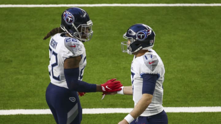 Jan 3, 2021; Houston, Texas, USA; Tennessee Titans running back Derrick Henry (22) and quarterback Ryan Tannehill (17) celebrate after a touchdown play during the third quarter against the Houston Texans at NRG Stadium. Mandatory Credit: Troy Taormina-USA TODAY Sports