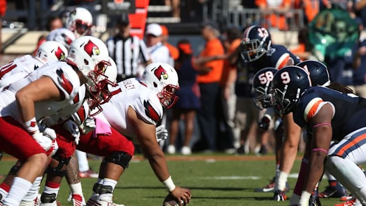 Oct 29, 2016; Charlottesville, VA, USA; The Louisville Cardinals offense lines up against the Virginia Cavaliers defense in the second quarter at Scott Stadium. Mandatory Credit: Geoff Burke-USA TODAY Sports