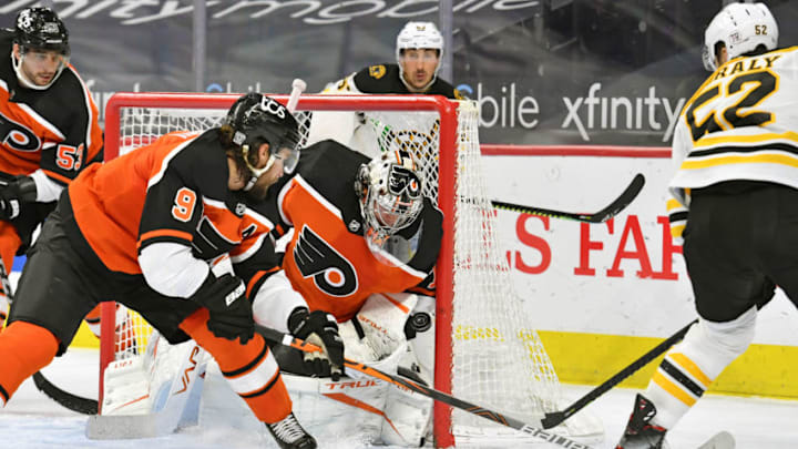 Feb 3, 2021; Philadelphia, Pennsylvania, USA; Philadelphia Flyers goaltender Carter Hart (79) makes a save against Boston Bruins center Sean Kuraly (52) during the third period at Wells Fargo Center. Mandatory Credit: Eric Hartline-USA TODAY Sports