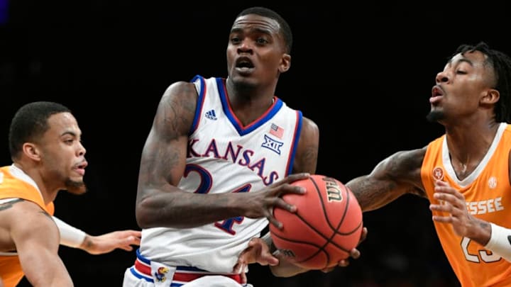 NEW YORK, NEW YORK - NOVEMBER 23: Lagerald Vick #24 of the Kansas Jayhawksdribbles past Tennessee Volunteers defense during the first half of the game at the NIT Season Tip-Off Tournament at Barclays Center on November 23, 2018 in the Brooklyn borough of New York City. (Photo by Sarah Stier/Getty Images)