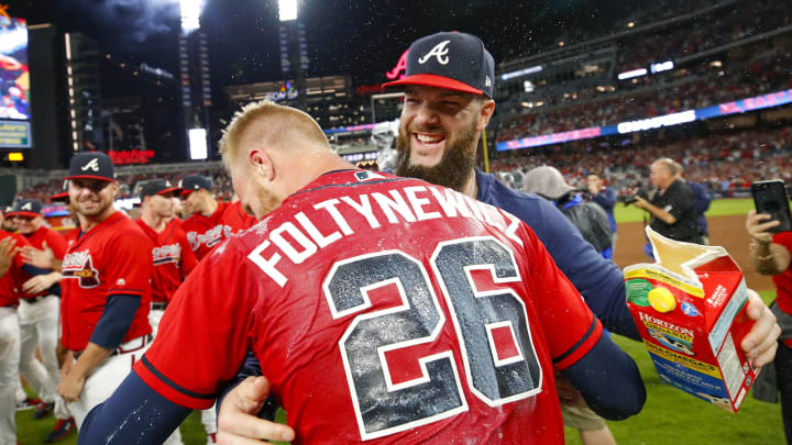 ATLANTA, GA – SEP 20: Dallas Keuchel #60 of the Atlanta Braves dunks Mike Foltynewicz #26 of the Atlanta Braves with milk at the conclusion of an MLB game against the San Francisco Giants in which they clinched the N.L. East at SunTrust Park on September 20, 2019 in Atlanta, Georgia. (Photo by Todd Kirkland/Getty Images)