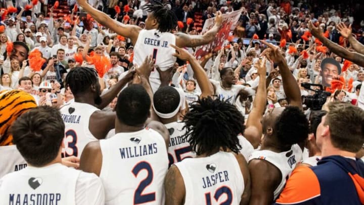 Auburn players celebrate with fans after the game at Auburn Arena in Auburn, Ala., on Tuesday, Feb. 1, 2022. Auburn Tigers defeated Alabama Crimson Tide 100-81.
