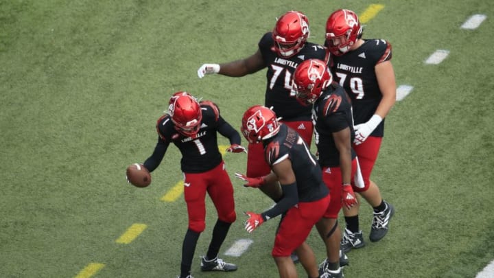 LOUISVILLE, KENTUCKY - OCTOBER 24: Tutu Atwell #1 of the Louisville Cardinals celebrates with teammates after catching a pass for a touchdown against the Florida State Seminoles at Cardinal Stadium on October 24, 2020 in Louisville, Kentucky. (Photo by Andy Lyons/Getty Images)