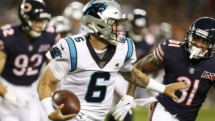 CHICAGO, ILLINOIS – AUGUST 08: Taylor Heinicke #6 of the Carolina Panthers carries the ball against Jonathon Mincy #31 of the Chicago Bears during the second half of a preseason at Soldier Field on August 08, 2019 in Chicago, Illinois. (Photo by Nuccio DiNuzzo/Getty Images)