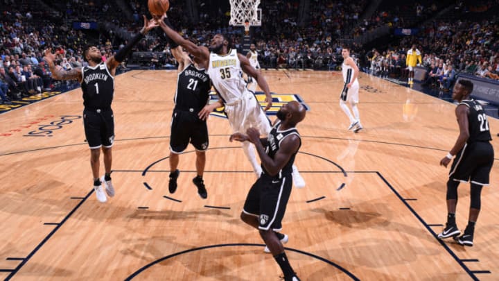 DENVER, CO - NOVEMBER 7: D'Angelo Russell #1 of the Brooklyn Nets and Kenneth Faried #35 of the Denver Nuggets vie for the ball during the game on November 7, 2017 at the Pepsi Center in Denver, Colorado. NOTE TO USER: User expressly acknowledges and agrees that, by downloading and/or using this Photograph, user is consenting to the terms and conditions of the Getty Images License Agreement. Mandatory Copyright Notice: Copyright 2017 NBAE (Photo by Garrett Ellwood/NBAE via Getty Images)