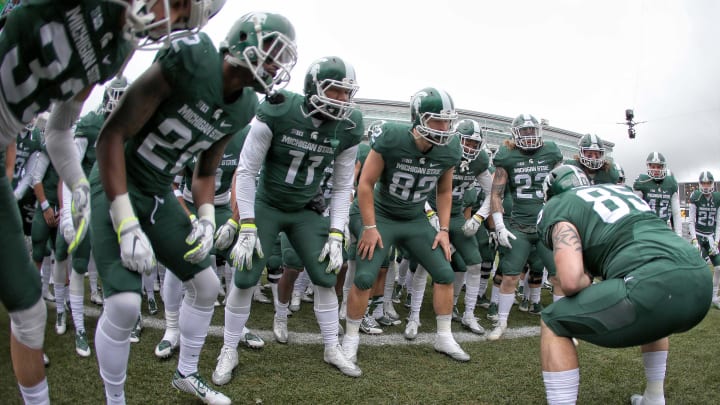 Nov 19, 2016; East Lansing, MI, USA; Michigan State Spartans players huddle on the field prior to their game against the Ohio State Buckeyes at Spartan Stadium. Mandatory Credit: Mike Carter-USA TODAY Sports