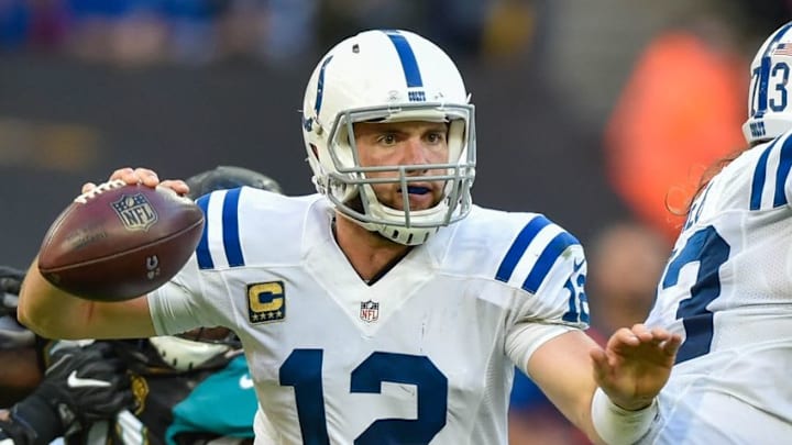 Oct 2, 2016; London, ENG; Indianapolis Colts quarterback Andrew Luck (12) works around Jacksonville Jaguars defense during the fourth quarter at Wembley Stadium. Mandatory Credit: Steve Flynn-USA TODAY Sports
