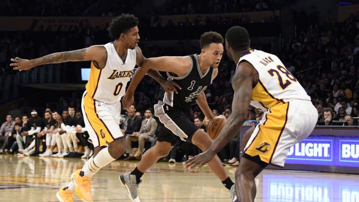 Feb 26, 2017; Los Angeles, CA, USA; San Antonio Spurs guard Kyle Anderson (1) drives against Los Angeles Lakers guard Nick Young (0) and center Tarik Black (28) in the second half at Staples Center. Mandatory Credit: Richard Mackson-USA TODAY Sports