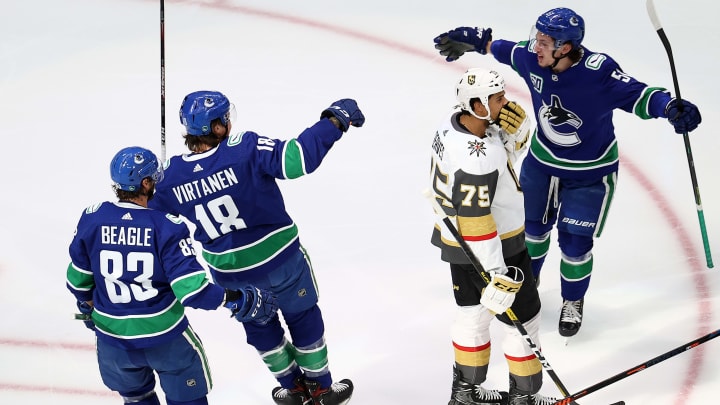 Vancouver Canucks’ Jake Virtanen is congratulated by his team after scoring (Photo by Bruce Bennett/Getty Images)