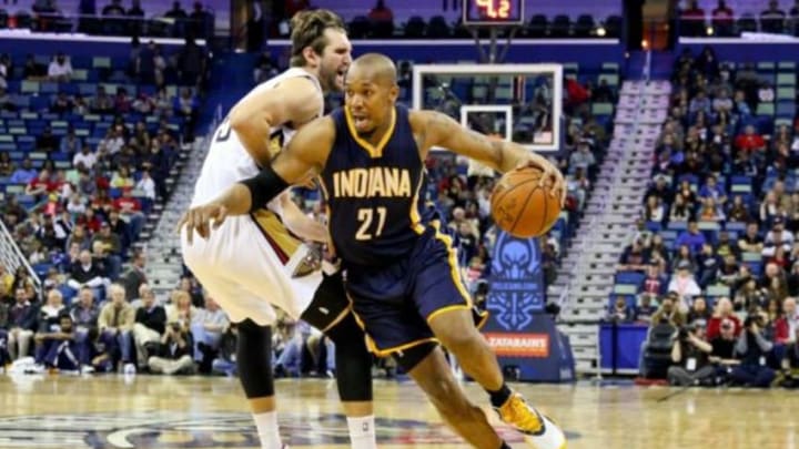 Feb 11, 2015; New Orleans, LA, USA; Indiana Pacers forward David West (21) drives past New Orleans Pelicans center Jeff Withey (5) during the first quarter of a game at the Smoothie King Center. Mandatory Credit: Derick E. Hingle-USA TODAY Sports