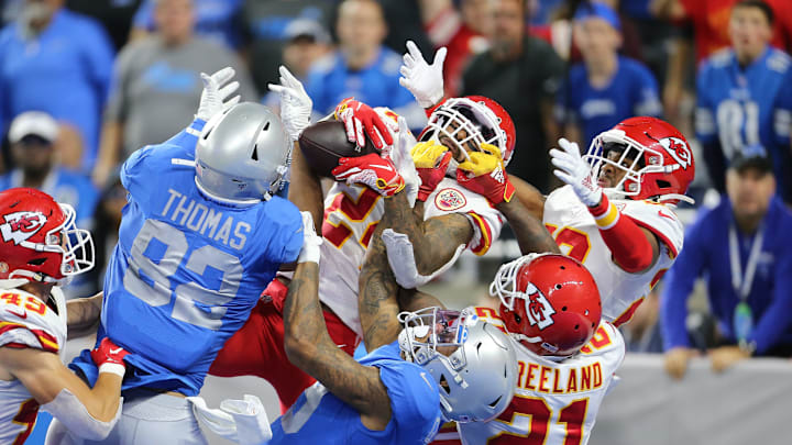 Jordan Lucas #24 of the Kansas City Chiefs battles for the Hail Mary in the fourth quarter against Logan Thomas #82 and Kenny Golladay #19 of the Detroit Lions (Photo by Rey Del Rio/Getty Images)