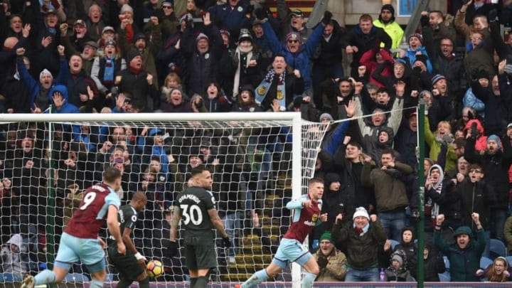 Burnley's Icelandic midfielder Johann Berg Gudmundsson (R) celebrates scoring their first goal to equalise 1-1 during the English Premier League football match between Burnley and Manchester City at Turf Moor in Burnley, north west England on February 3, 2018. / AFP PHOTO / Oli SCARFF / RESTRICTED TO EDITORIAL USE. No use with unauthorized audio, video, data, fixture lists, club/league logos or 'live' services. Online in-match use limited to 75 images, no video emulation. No use in betting, games or single club/league/player publications. / (Photo credit should read OLI SCARFF/AFP/Getty Images)