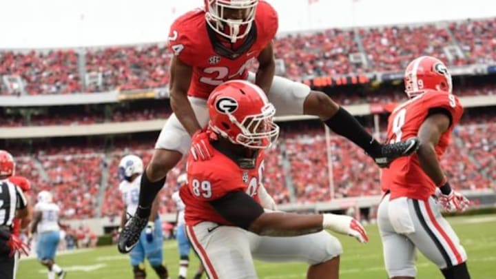 Sep 26, 2015; Athens, GA, USA; Georgia Bulldogs safety Dominick Sanders (24) and defensive tackle James DeLoach (89) react after a tackle against the Southern University Jaguars during the second half at Sanford Stadium. Georgia defeated Southern 48-6. Mandatory Credit: Dale Zanine-USA TODAY Sports Sep 26, 2015; Athens, GA, USA; Georgia Bulldogs safety Dominick Sanders (24) and defensive tackle James DeLoach (89) react after a tackle against the Southern University Jaguars during the second half at Sanford Stadium. Georgia defeated Southern 48-6. Mandatory Credit: Dale Zanine-USA TODAY Sports